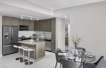 A modern kitchen with a dining table